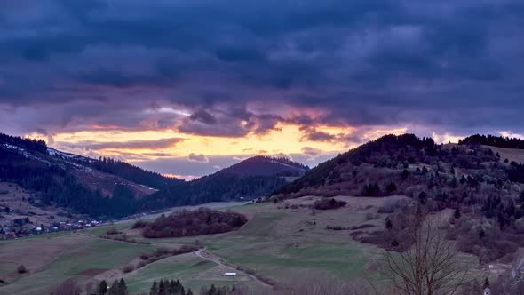 Rural Hilly Spring Landscape Dense Clouds with Fast Movement Colors at Blue Hour Timelapse