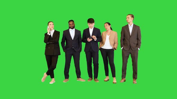 Group of Colleages Wait Looking at Watch Time is Running Out on a Green Screen Chroma Key