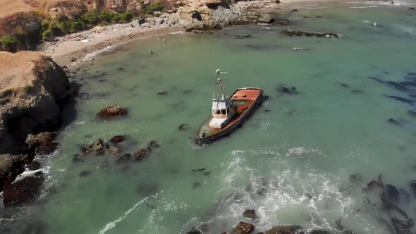 Drone Flies Around Ship Wreck in Ocean in Cayucos