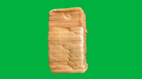 Whole wheat bread rotation on chroma key green screen background, Close up. alt