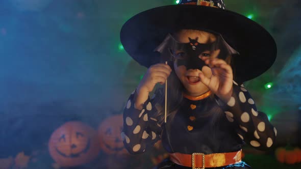Girl Child In A Witch Costume For A Scary Halloween Party alt
