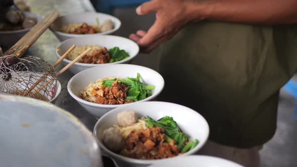 Preparing chicken noodles.Indonesia street food