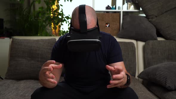 Bearded Man in T-shirt Play VR or Virtual Reality Glasses Game. alt