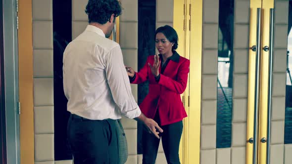 The Female Staff is Standing to Check the Ticket alt
