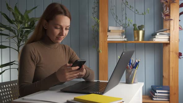 Young Woman Sitting at Desk Distracted From Study Selfeducation