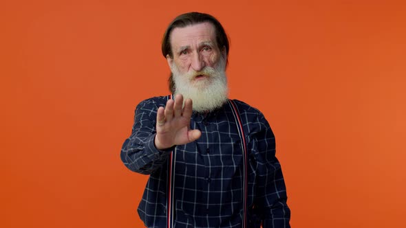 Elderly Bearded Grayhaired Man Say No Stop Gesture Warning of Finish Prohibited Access Declining alt