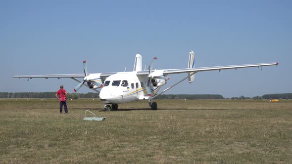 The Technician Visually Assesses the Performance of the Aircraft Engines Before Takeoff