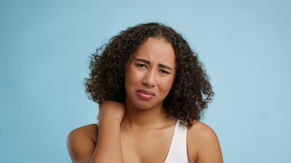 African American Lady Suffering From Nech Pain Over Blue Background alt