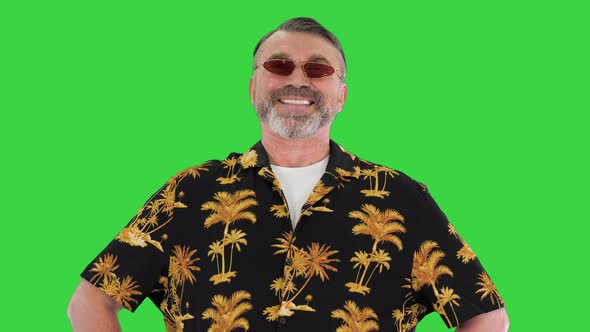 Successful Old Man in Sunglasses on a Vacation Looking To Camera on a Green Screen Chroma Key alt