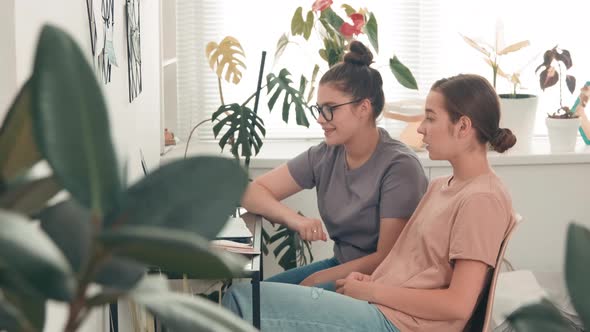 Female Students Talking on Video Call with Teacher alt