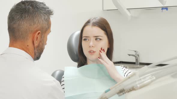 Charming Young Woman Having Toothache Visiting Her Dentist