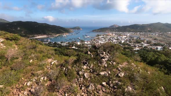Village on shores of little harbor in Vietnam. Aerial forward alt