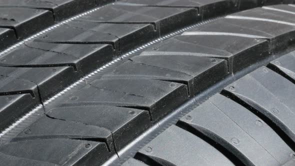 Car rubber  tire details 4K slow tilt footage alt