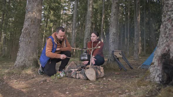 A Beautiful Cinematic Shot of Two Young Tourists a Man and a Woman in Wood alt