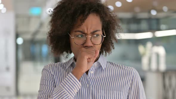 Sick Young African Businesswoman Coughing alt