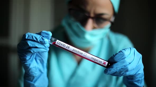 Doctor holding a negative coronavirus COVID-19 test result