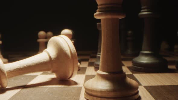 Fallen Chess King Piece on the Chessboard alt