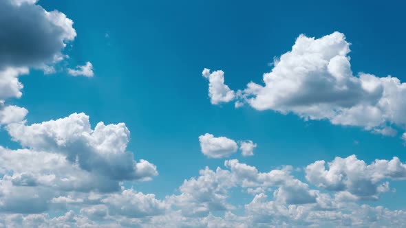 Timelapse of Light White Puffy Clouds Moving in the Blue Sky Cloud Space alt