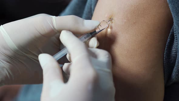 close-up nurse giving a vaccine for a patient