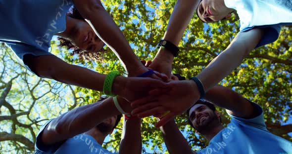 Volunteers forming a hand stack 4k alt