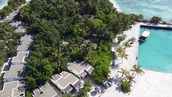 Aerial View of a Tropical Paradise Island Bay Covered in Limestone Trees with Crystal Clear Beach