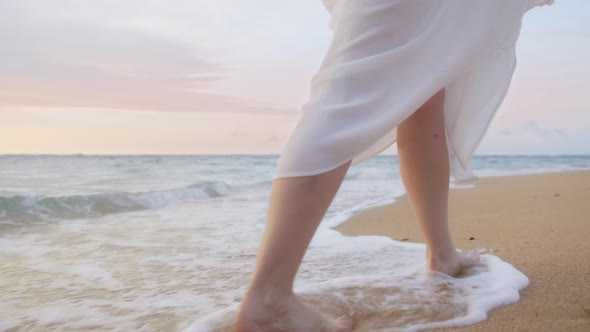 Close Up Woman Feet Walking Barefoot By Beach in Sunset Light Slow Motion Waves alt