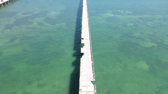 distant aerial descending onto the Old Bahia Honda Bridge alt