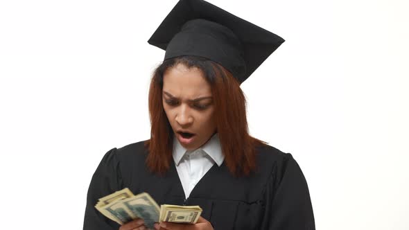 Dissapointed African American Female Graduate Counting Dollars and Doesn't Understand What's Going alt