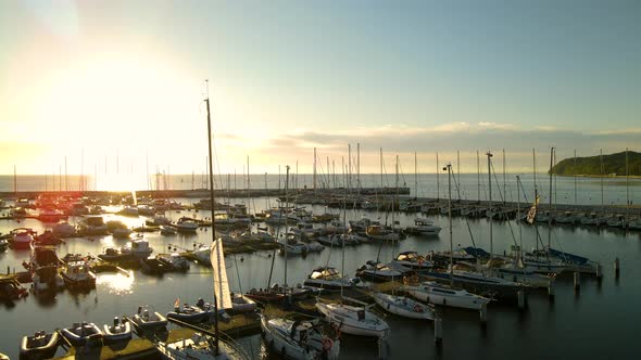 Vibrant Sunlight Reflection On The Calm Water Of Gdańsk Bay With Sailboats Moored At Gdynia City Por alt