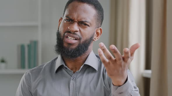 Disgruntled Angry Bearded Black Businessman Clerk Office Employee or HR Manager Looking at Camera alt