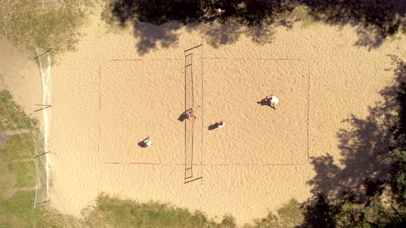 No players identified in action during to plaing Volleyball. Aerial shot alt