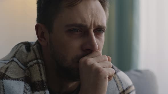 Coronavirus Infected Man Coughing Hard Wrapped in Plaid at Home Interior Slow Motion Free Space alt