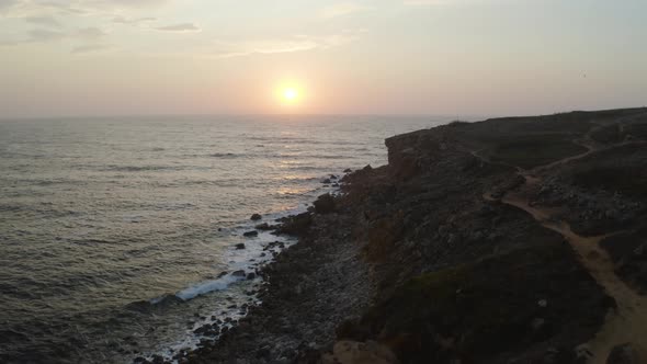 Aerial View of the Coastline and Cliffs During Sunset Near the City of Peniche. Portugal in the