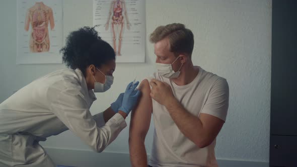 Man Patient Getting Covid19 Vaccine in Clinic Close Up alt