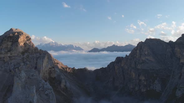 Aerial Shot of Caucasus Mountain Peaks Above Clouds at Sunset