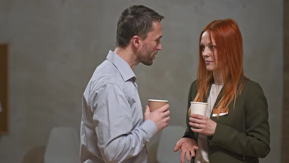 Couple Talking During Coffee Break at Mental Support Group Meeting alt