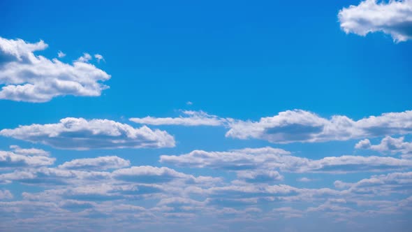 Timelapse of White Clouds Move and Dissolve in the Blue Sky Cloudy Space alt