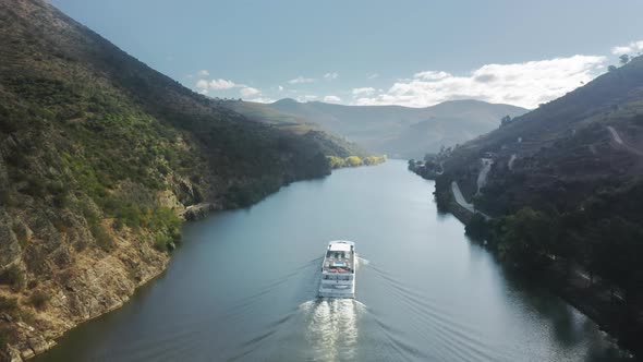 Boat Floating in Picturesque Mountains Landscape Peso Da Regua Portugal alt