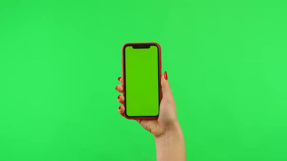 Female Hand Holds Mobile Phone with Workspace Mock Up Screen on Green Background in Vertical and alt
