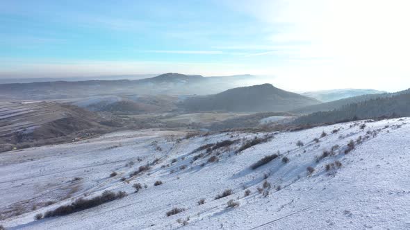Aerial View of Frosty Winter Landscape in a Bright Sunny Day alt
