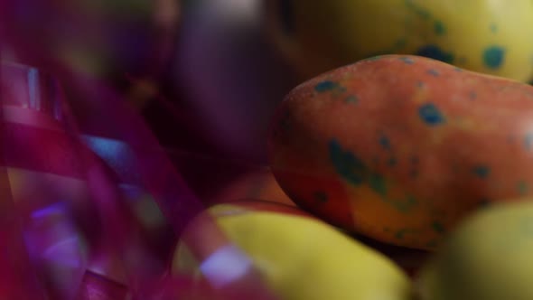 Rotating shot of colorful Easter candies on a bed of easter grass - EASTER 182 alt