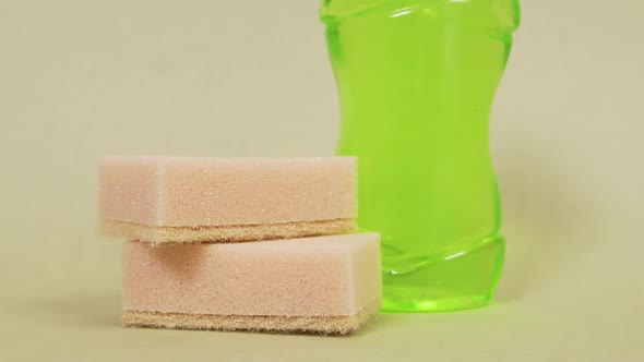 Dish Washing Sponges and Detergent in a Clear Bottle