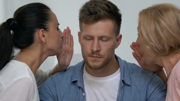 Tired Man Pushing Away Mother and Wife Complaining About Each Other, Conflict alt