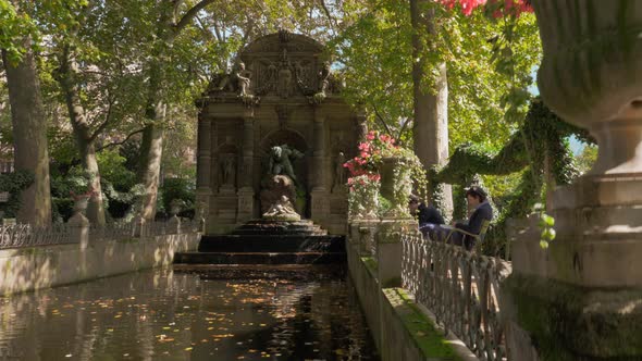 Scene with Medici Fountain in Luxembourg Gardens Paris, France alt