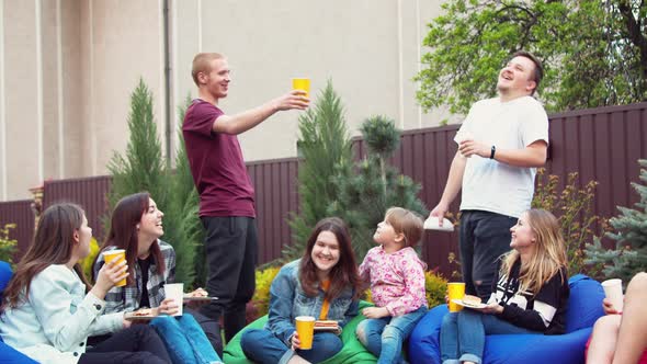 Friends Having Picnic in a Garden