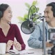 Audio Podcast studio and radio online, portrait Asian woman and man working using microphone and lap - VideoHive Item for Sale