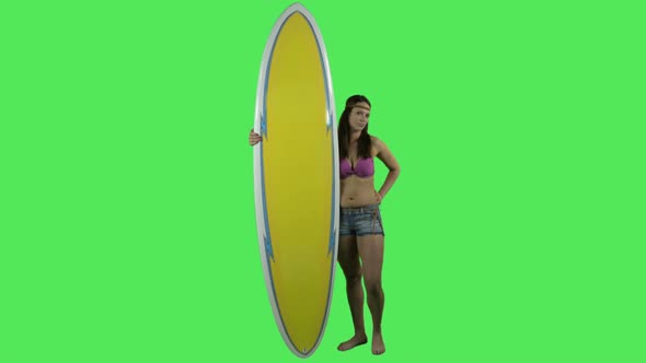 Female surfer with surfboard