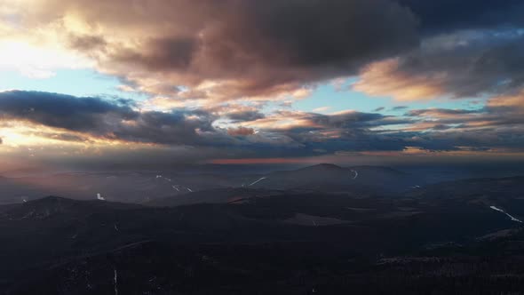 Ultimate Timelapse. Beatifull and smooth fly above winter forest and beskid mountains during sunset.