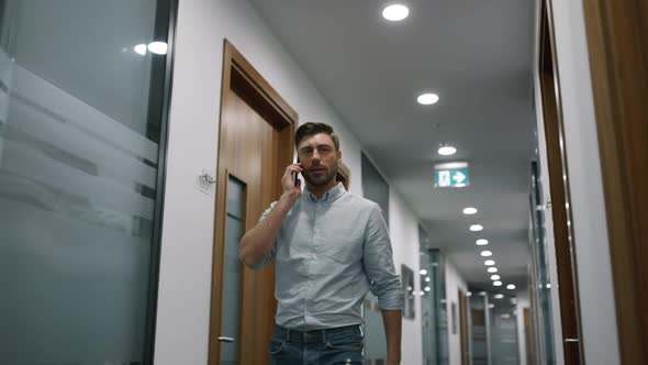 Serious Executive Phone Talking in Office alt