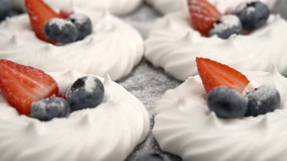 Camera Movement on Vanilla Meringue with Blueberries and Strawberries